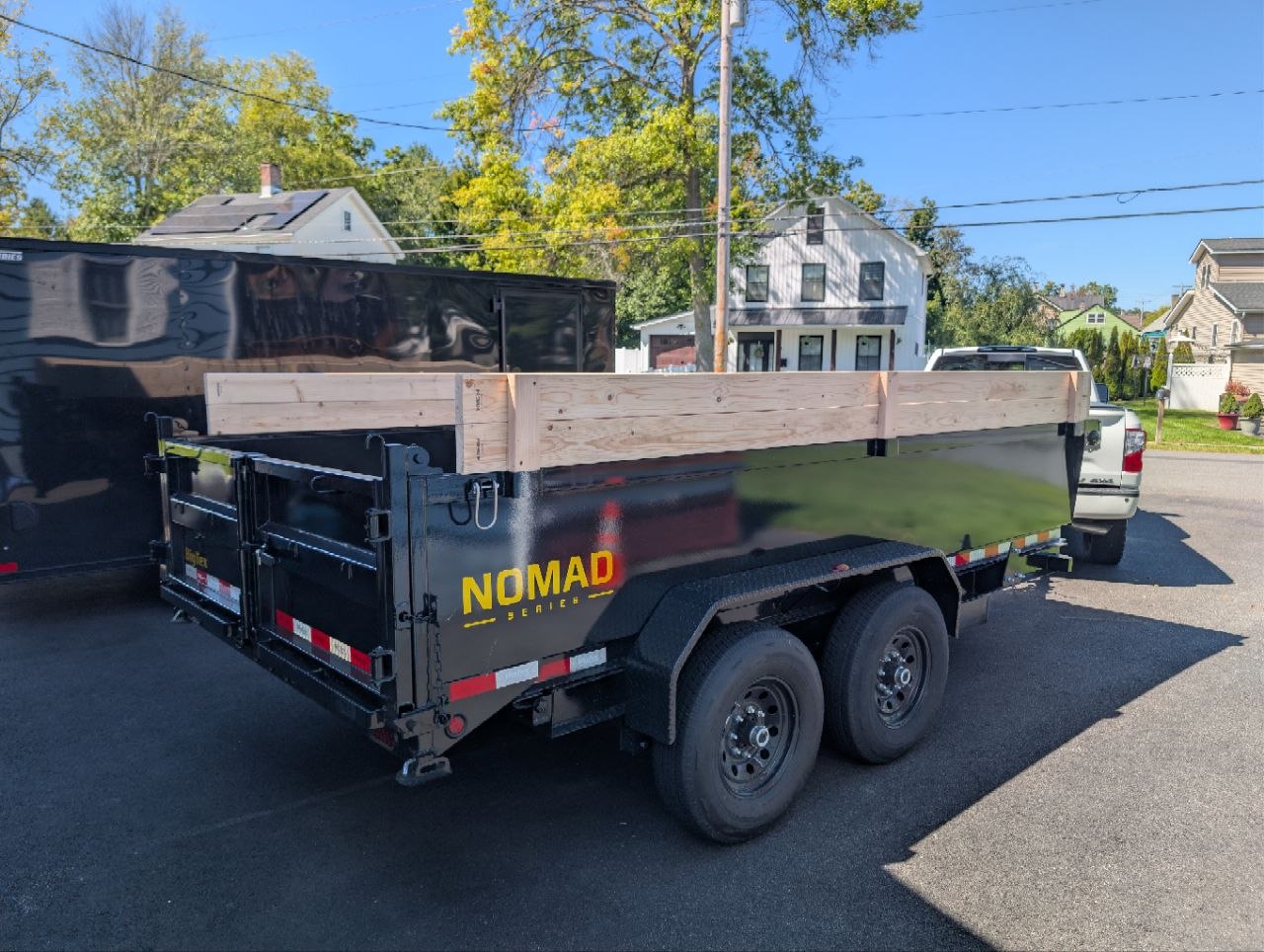 Craig's Hauling dump trailer connected to a pickup truck
