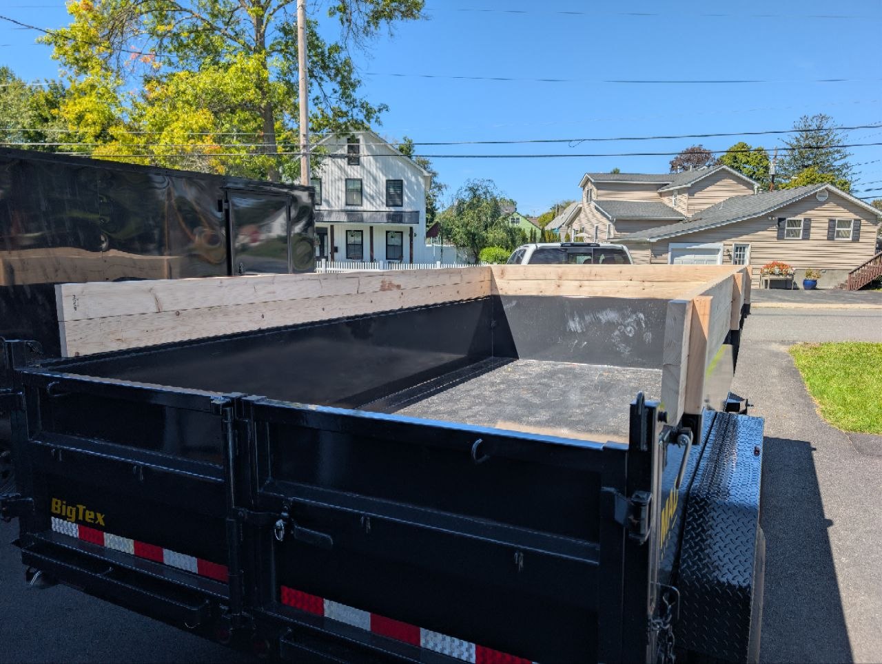Empty 7 by 14 dump trailer ready for a hauling job