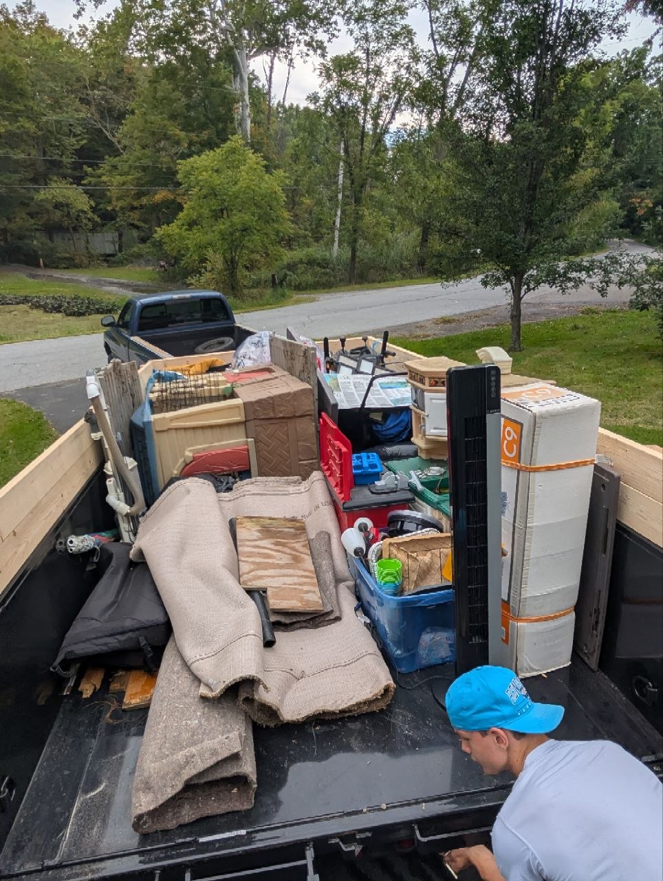Dump trailer loaded with household items from a cleanout